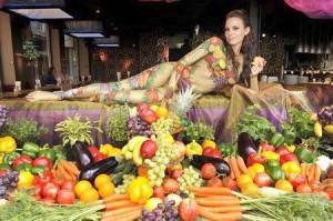 woman body paint vegetables fruits