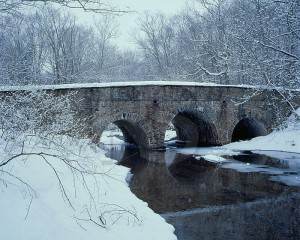 pidcock creek stone bridge in winter pa